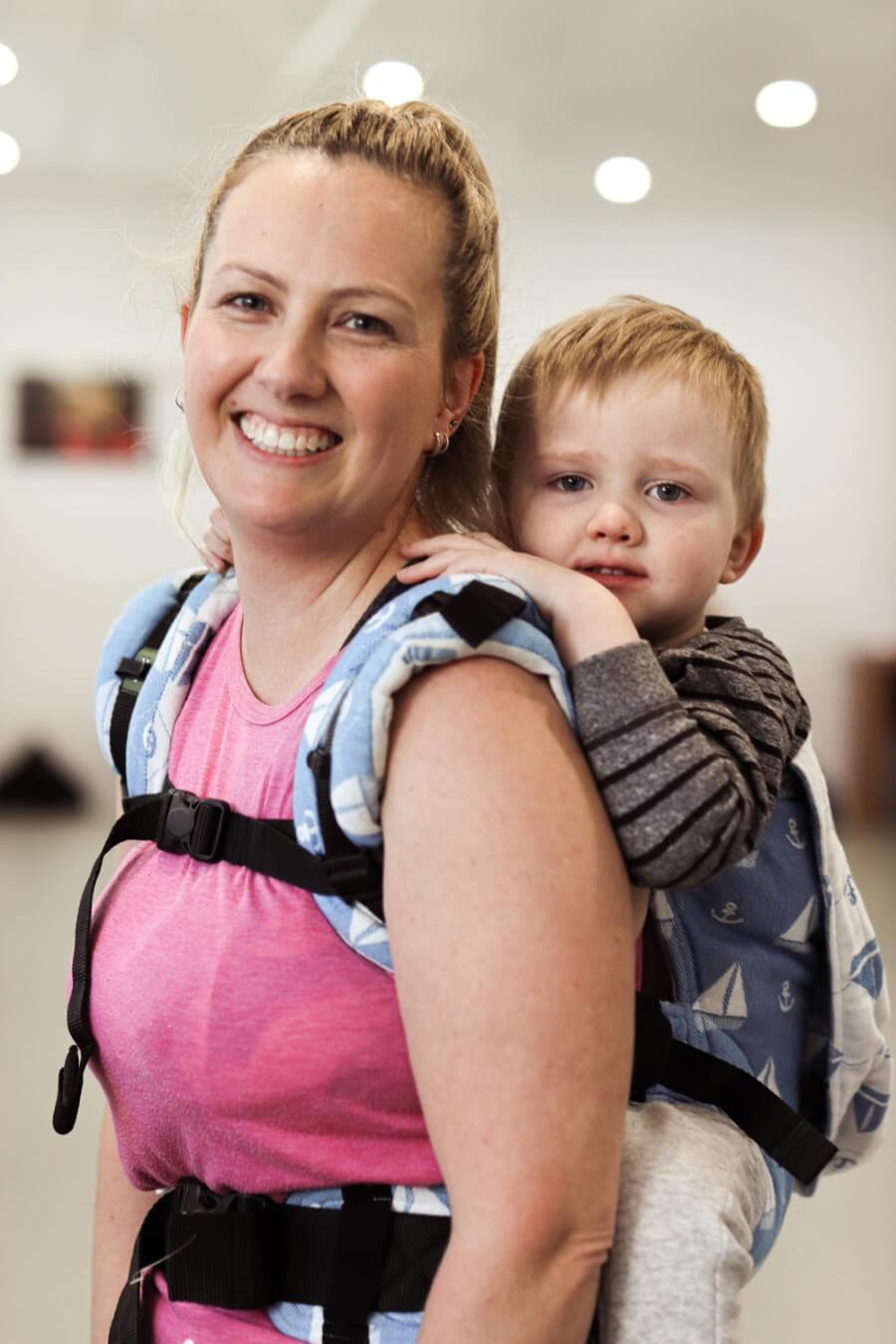 Mel Jessup with baby on her back in a carrier